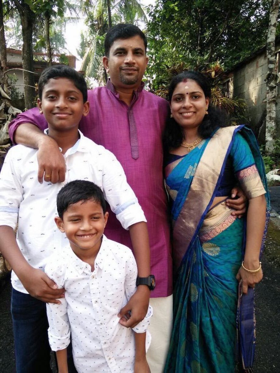 Anish pictured with his wife and two sons